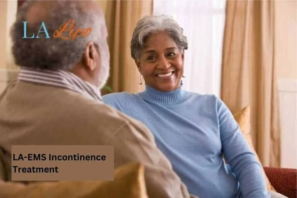 Couple sat smiling at each other - LA-EMS treatment Northamptonshire